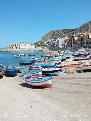 a bunch of boats sitting on a beach at I TRAMONTI D'ASPRA in Bagheria