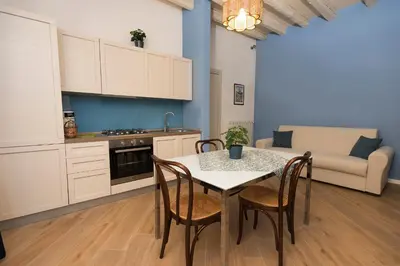 a kitchen and dining room with a table and chairs at La casetta di Maria alla Ciba in Termini Imerese