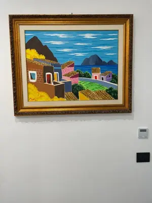 a painting hanging on a wall in a museum at Case vacanze donna Ina in Palermo