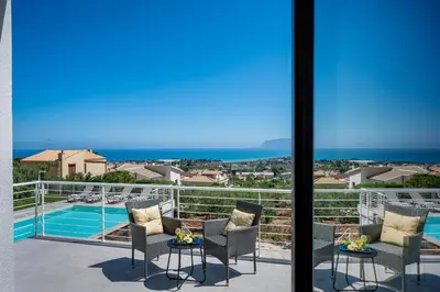 a balcony with chairs and a view of the ocean at Villa Maria con piscina e vista mare in Castellammare del Golfo