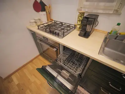 a kitchen with a counter with a sink and a stove at Itiseasy Palermo 1 e 2 Private Apartments in Palermo