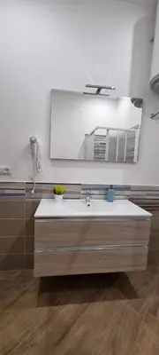 a bathroom with a sink and a mirror at Christian Guest House in Terrasini