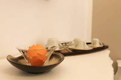 a bowl with a candle in it on a table at A casa di Enza B&B in Palermo