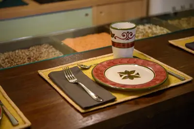 a table with a plate and a fork and knife at CELSO 14 in Palermo