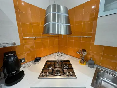 a kitchen with a stove top oven in a kitchen at Essenze di Sicilia Appartamento Cavour in centro in Palermo