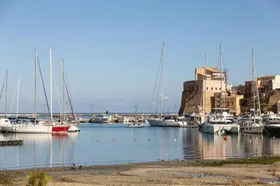 a bunch of boats are docked in a harbor at Home holiday Kalanto in Castellammare del Golfo