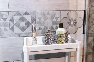 a white sink in a bathroom with two bottles at Casa vacanze Loft del Borgo in Palermo