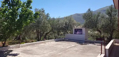 a house with a picture of a person in a window at Villa Andrea in Scopello