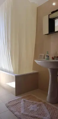 a bathroom with a sink and a white sink at Villa Andrea in Scopello