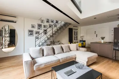 a living room with a couch and a table at Casa con Giardino all'ex Fabbrica di Pomodoro by Wonderful Italy in Palermo