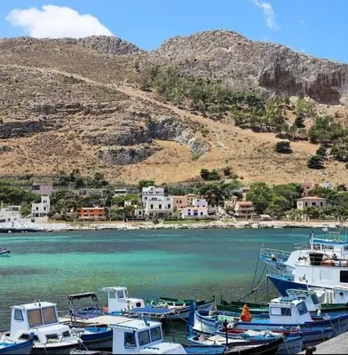 a group of boats docked in a body of water at Dolce Casa in Palermo