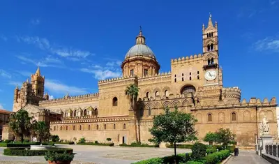 a large building with a clock tower on top of it at Dolce Casa in Palermo