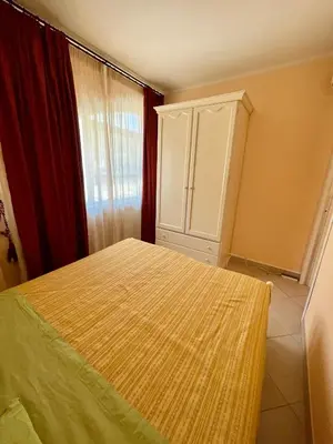 a bedroom with a bed and a cabinet and a window at La Casa di Martorana in Palermo