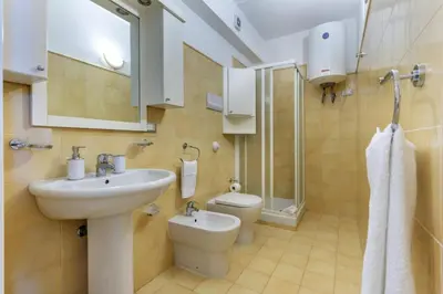 a bathroom with a sink and a toilet at La Casa di Martorana in Palermo