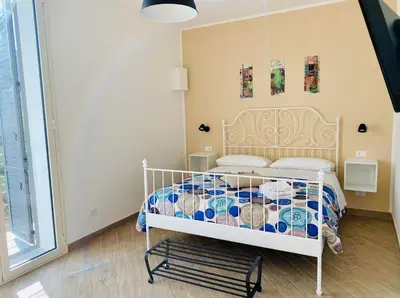 a bedroom with a white bed in a room at Pindemonte Suites in Palermo