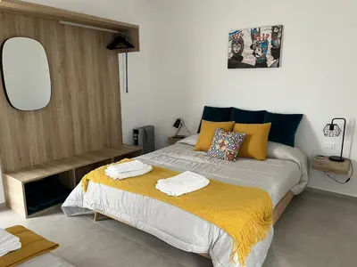 a bedroom with a bed with two towels on it at Casa RALIVO di Sicilia in Balestrate