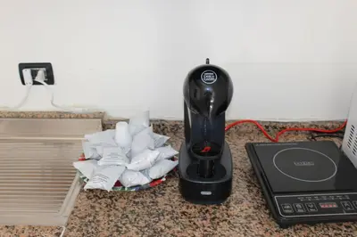 a hair dryer sitting on a counter next to a phone at Bianca Casa in Bolognetta