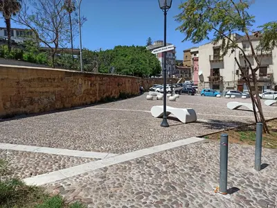 an alley with a cat walking down a street at 'A CASETTA RA ZIA PAOLA in Palermo