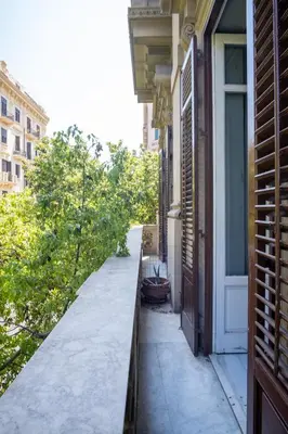 a sidewalk outside of a building with a door at Rome 118 in Palermo