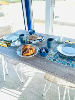 a table with plates of food on top of it at B&B Torre Pozzillo in Cinisi