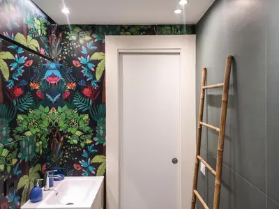 a bathroom with a sink and a floral wallpaper at A NICAREDDA in Palermo