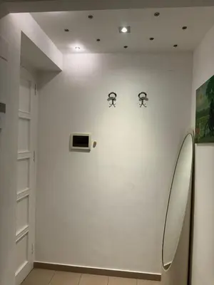 a white wall with three mirrors on it at ART GALLERY HOUSE La casa dell’arte in Palermo