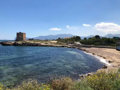 a body of water with a castle in the background at Villa Carta Fashion by Interhome in Terrasini