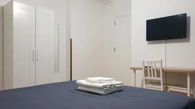 a room with a bed with towels on top of it at Sweet Home in Palermo