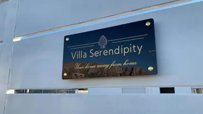 a sign on the wall of a building at Villa Serendipity Terrasini in Terrasini