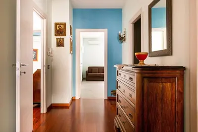 a room with a dresser with a mirror on it at Palermo old style - Boutique apartment with terrace in center city in Palermo