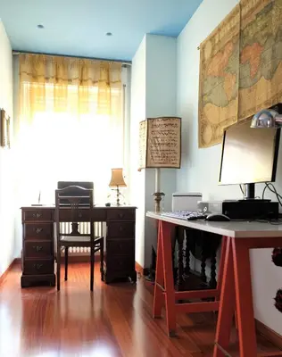 a room with a desk and a table and a chair at Palermo old style - Boutique apartment with terrace in center city in Palermo