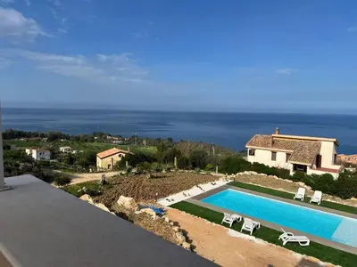 a swimming pool in front of a house at Apt Perterrepermari a 2 Km Da Riserva Dello Zingaro in Scopello