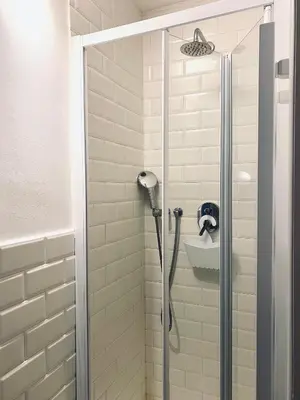 a shower with a shower head in a bathroom at Da Marlà al Politeama in Palermo