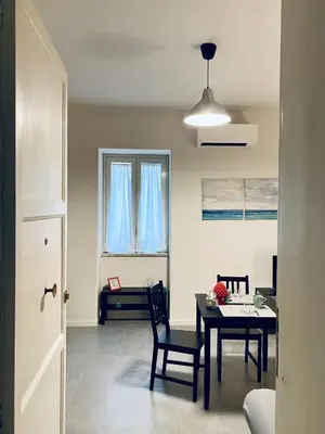 a kitchen and dining room with a table and chairs at Da Marlà al Politeama in Palermo