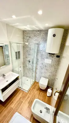 a bathroom with a shower and a sink and a toilet at Casa Mare in San Vito lo Capo