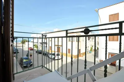 a balcony with a view of a parking lot at Casa Mare in San Vito lo Capo