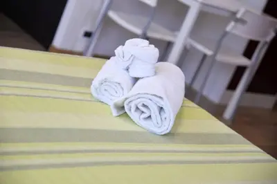 a towel sitting on top of a bed at Casa Sole in San Vito lo Capo