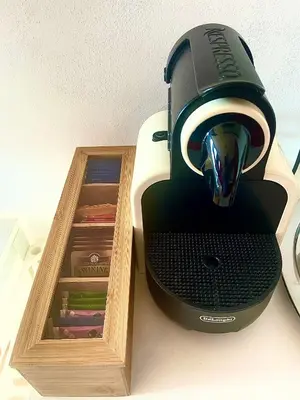 a toaster sitting on a table next to a wooden box at Casa Sole in San Vito lo Capo