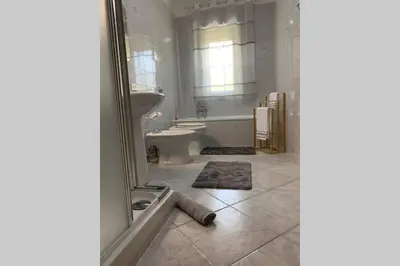 a bathroom with a tub and a toilet and a sink at Casa vacanza - I Mulini con parcheggio gratuito incluso. in Monreale