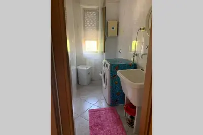 a bathroom with a sink and a toilet at Casa vacanza - I Mulini con parcheggio gratuito incluso. in Monreale