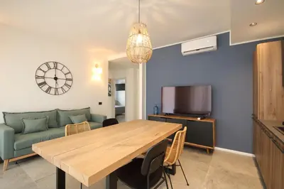 a living room with a wooden table and a couch at Al Covo dei Mori in Bagheria