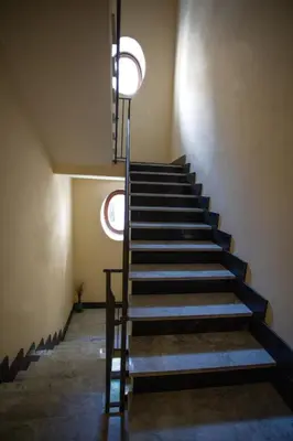 a staircase in a building with a stair case at Sol&Luna 1909 Tourist Location in Old Town in Palermo