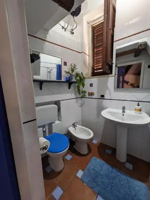 a bathroom with a toilet and a sink at Nassa Apartment in Trappeto