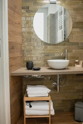 a bathroom with a sink and a mirror at Vicolo del Salto in Palermo