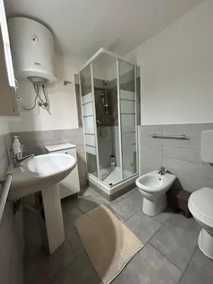 a bathroom with a sink and a toilet and a shower at Case Vacanze Seggettieri in Palermo