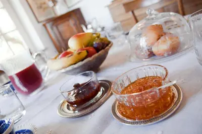 a table with a bowl of food and a bowl of fruit at Il Glicine sul Golfo in Mondello