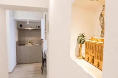 a small plant sitting on a ledge of a wall at Barlaman Luxury Rooms in Palermo