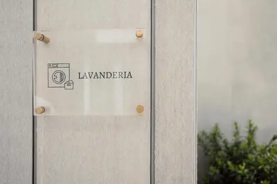 a sign on the side of a building at AR Palace Hotel - Palermo in Isola delle Femmine