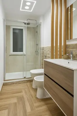 a bathroom with a toilet and a sink and a shower at AR Palace Hotel - Palermo in Isola delle Femmine