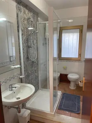 a bathroom with a shower and a sink and a toilet at Scopello sul mare 1 in Castellammare del Golfo